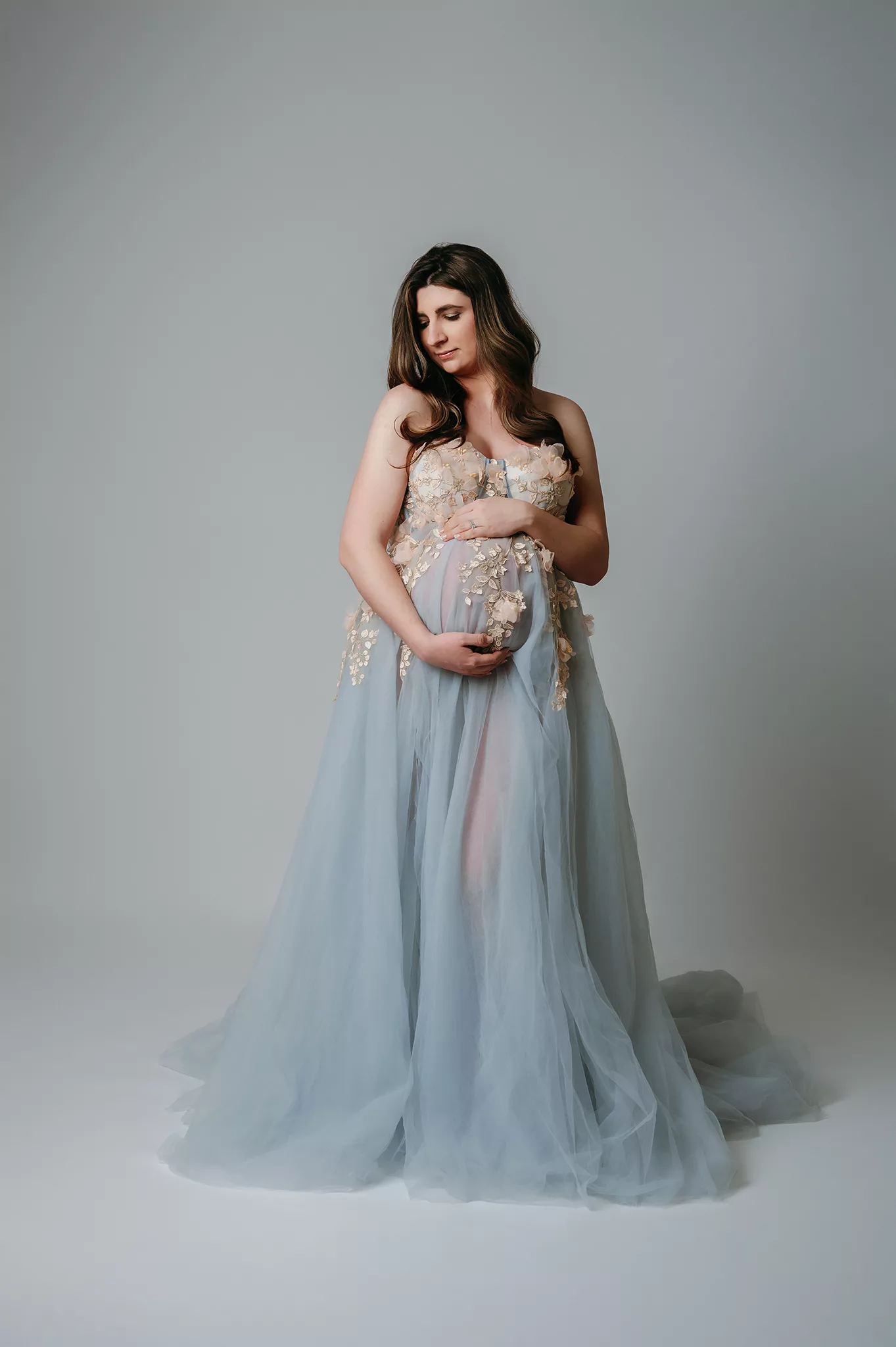 classy pregnancy photo with blue maternity gown