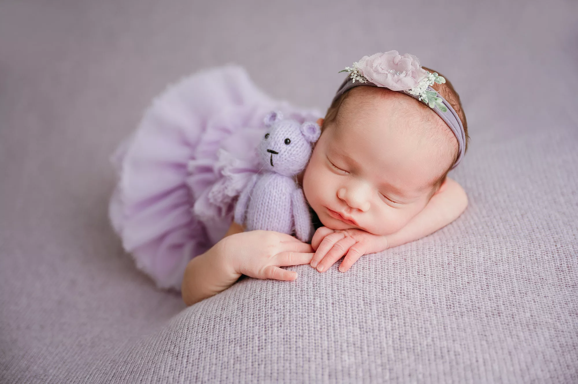 baby girl with purple dress | newborn with bear prop