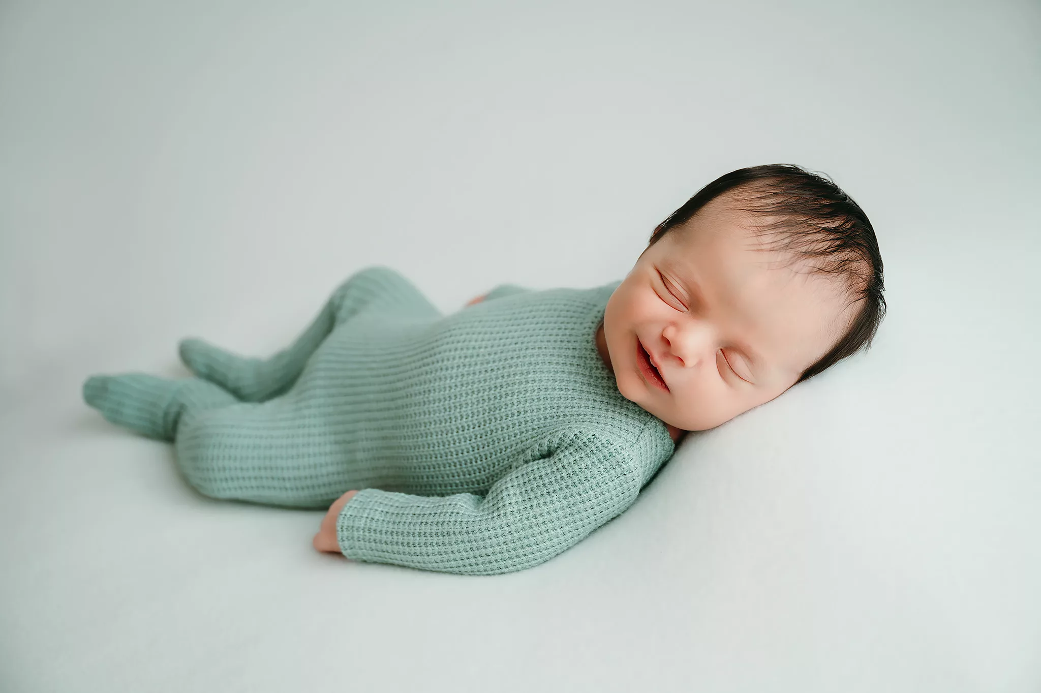 newborn baby smile | newborn studio photosession
