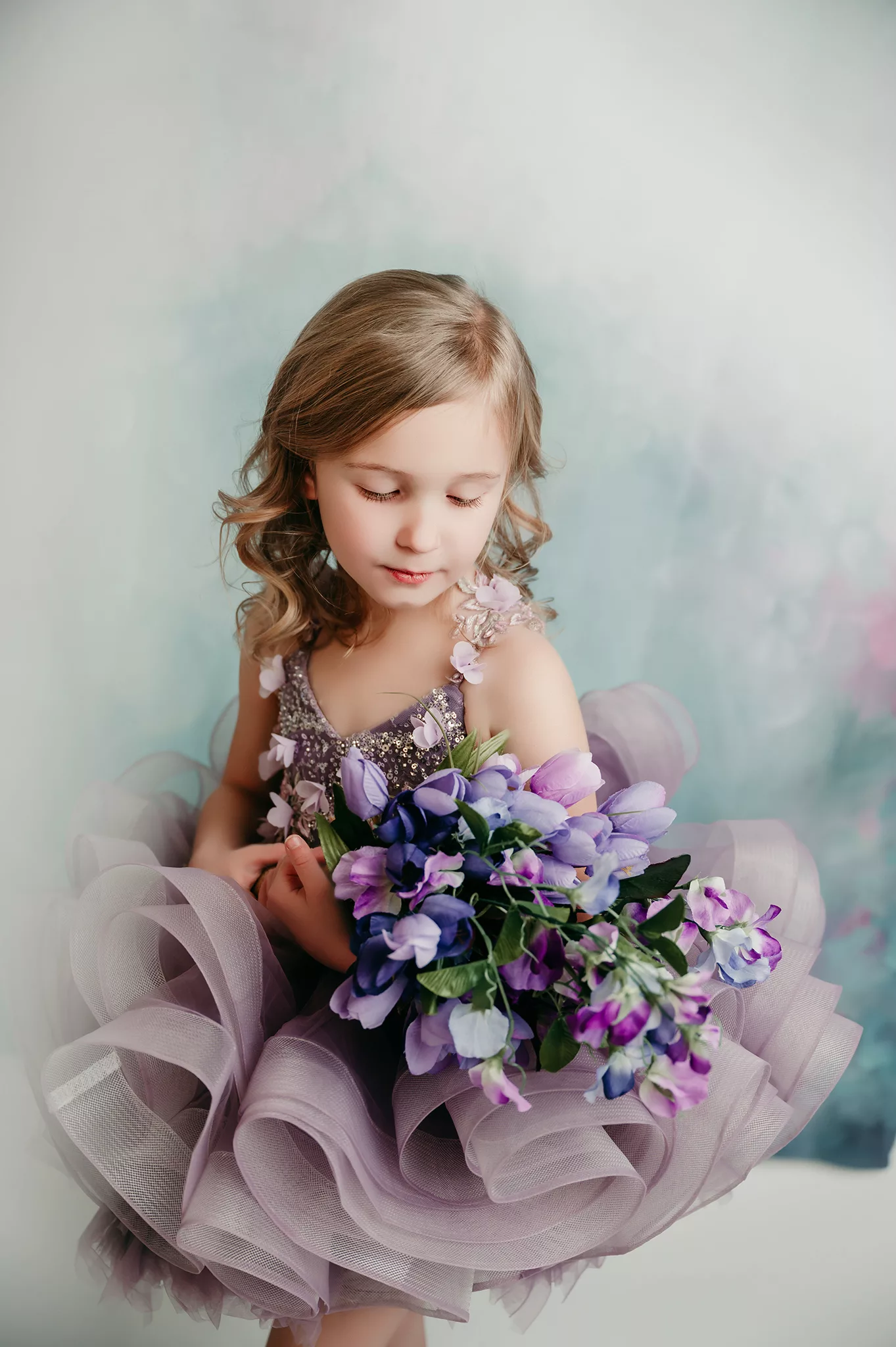 girls portrait with purple dress and flowers