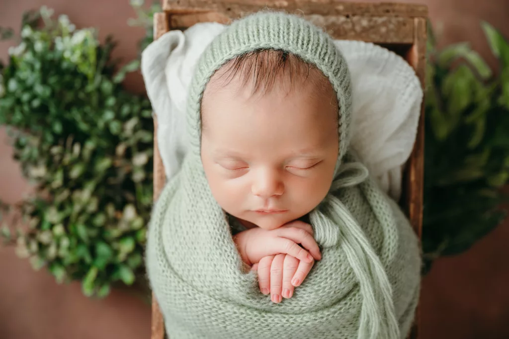 newborn baby in green | simple newborn photoshoot